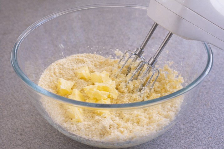 mixing butter with dry ingredients for Sri Lankan Christmas cake batter