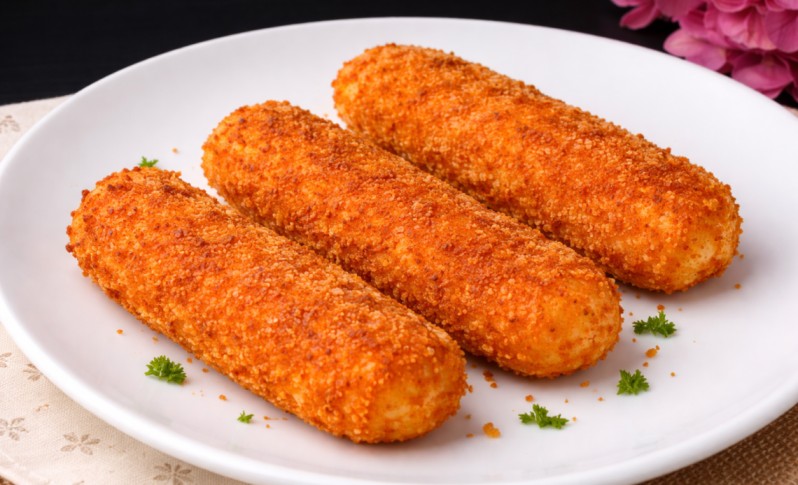 crispy mozzarella sticks with golden breadcrumb coating served on a plate