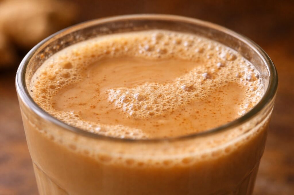 Close-up of masala chai foam and creamy texture