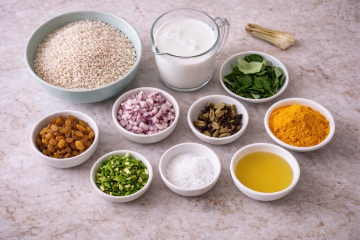 yellow-rice-ingredients-coconut-milk-spices.jpg ingredients for yellow rice including rice, coconut milk, spices, curry leaves and onions