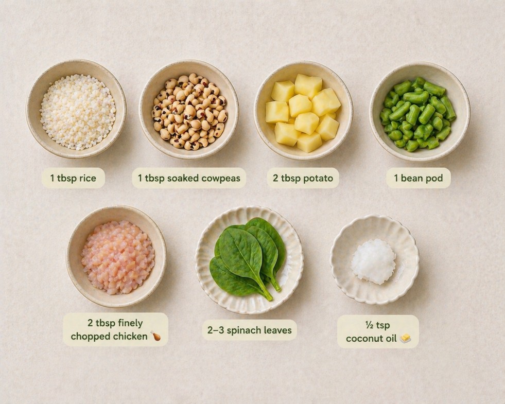 Baby food ingredients including rice, soaked cowpeas, potato, bean pod, chopped chicken, spinach leaves, and coconut oil arranged neatly in bowls